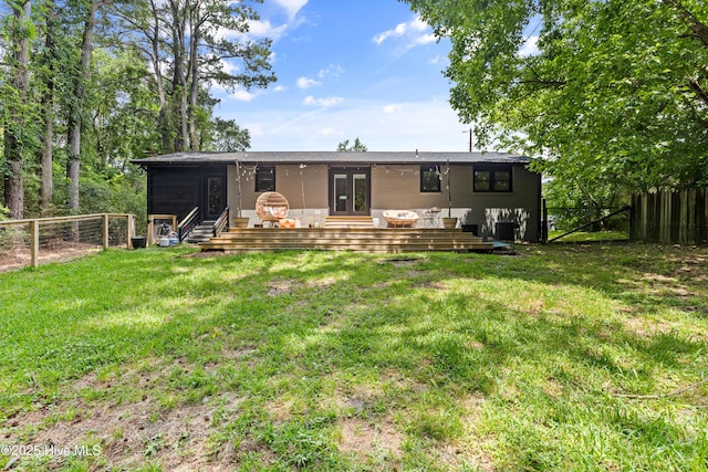 202 Regalwood Dr, Jacksonville, NC 28546 - back of house featuring a fenced backyard, a wooden deck, and french doors