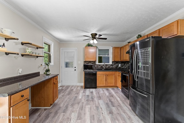 202 Regalwood Dr, Jacksonville, NC 28546 - kitchen with black appliances, light wood finished floors, decorative backsplash, ceiling fan, and crown molding