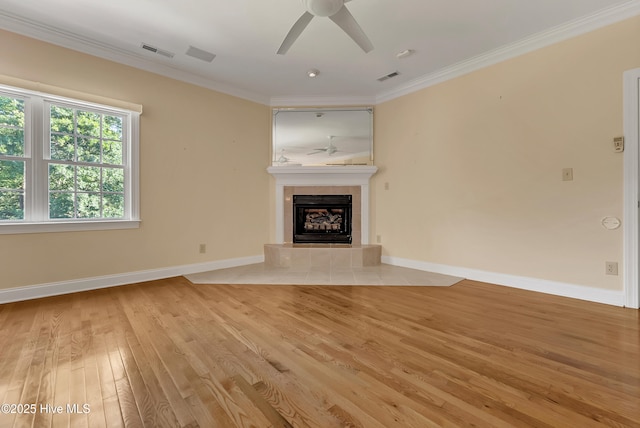 240 Drake Lndg, New Bern, NC 28560 - unfurnished living room with a ceiling fan, a fireplace, light wood finished floors, and crown molding