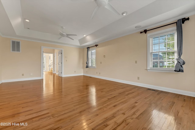 240 Drake Lndg, New Bern, NC 28560 - unfurnished room with ceiling fan, a tray ceiling, light wood finished floors, healthy amount of natural light, and recessed lighting