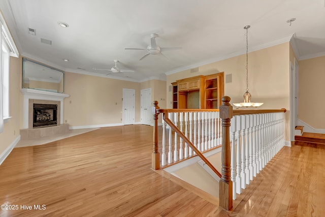 240 Drake Lndg, New Bern, NC 28560 - hallway with crown molding, light wood-style flooring, a chandelier, and an upstairs landing