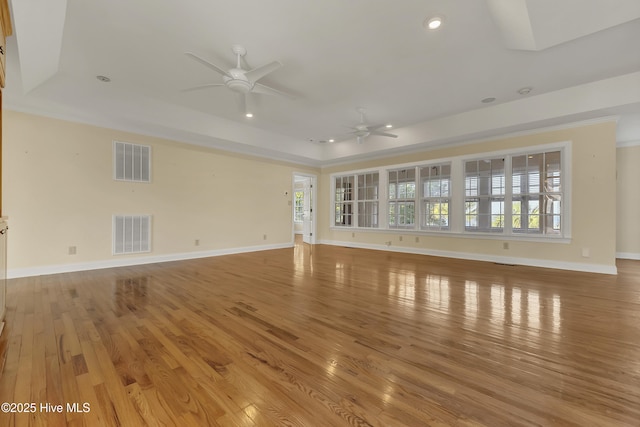 240 Drake Lndg, New Bern, NC 28560 - unfurnished living room featuring ceiling fan, a raised ceiling, light wood-type flooring, and recessed lighting