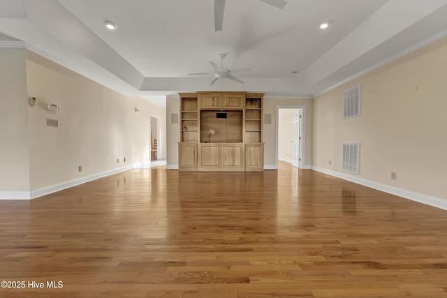 240 Drake Lndg, New Bern, NC 28560 - unfurnished living room featuring ceiling fan, light wood-style flooring, recessed lighting, a raised ceiling, and crown molding