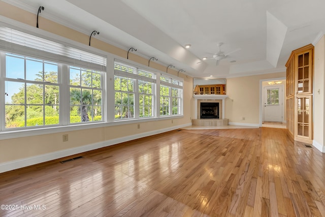 240 Drake Lndg, New Bern, NC 28560 - unfurnished living room with a ceiling fan, plenty of natural light, a fireplace, and light wood finished floors