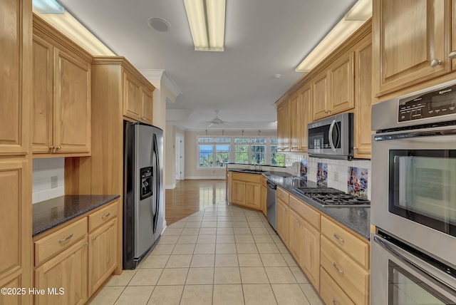 240 Drake Lndg, New Bern, NC 28560 - kitchen featuring stainless steel appliances, backsplash, light tile patterned floors, ceiling fan, and a peninsula