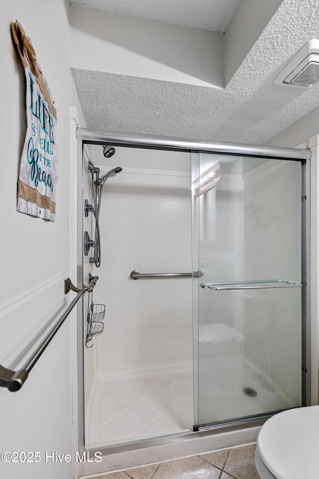 2000 New River Inlet Rd Unit 3513, North Topsail Beach, NC 28460 - full bath with a stall shower and a textured ceiling