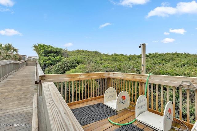 2000 New River Inlet Rd Unit 3513, North Topsail Beach, NC 28460 - wooden terrace featuring a view of trees