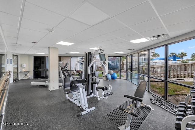 2000 New River Inlet Rd Unit 3513, North Topsail Beach, NC 28460 - gym with a paneled ceiling and floor to ceiling windows