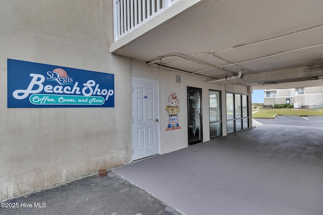 2000 New River Inlet Rd Unit 3513, North Topsail Beach, NC 28460 - doorway to property featuring stucco siding