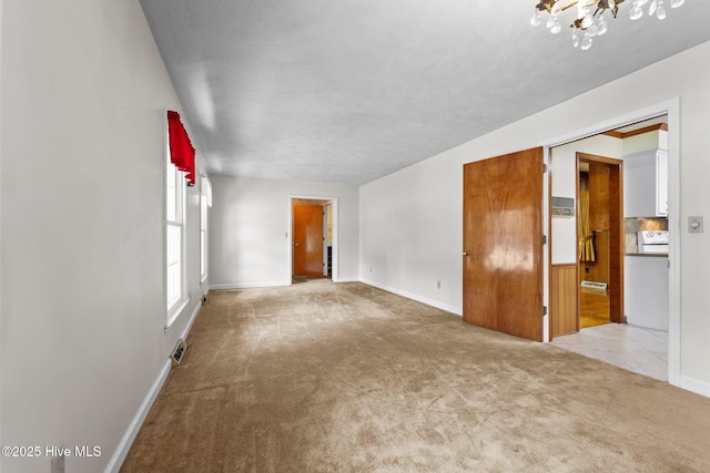 306 Mclean St, Hamlet, NC 28345 - unfurnished room featuring carpet floors and a chandelier