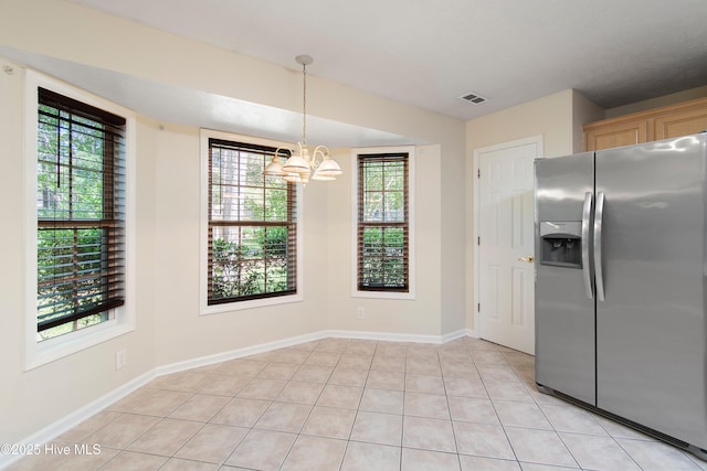 3 Gate 11, Carolina Shores, NC 28467 - kitchen with stainless steel refrigerator with ice dispenser, a chandelier, healthy amount of natural light, and decorative light fixtures