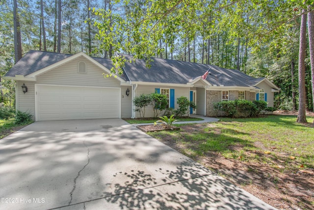 3 Gate 11, Carolina Shores, NC 28467 - single story home featuring concrete driveway, an attached garage, and a front yard
