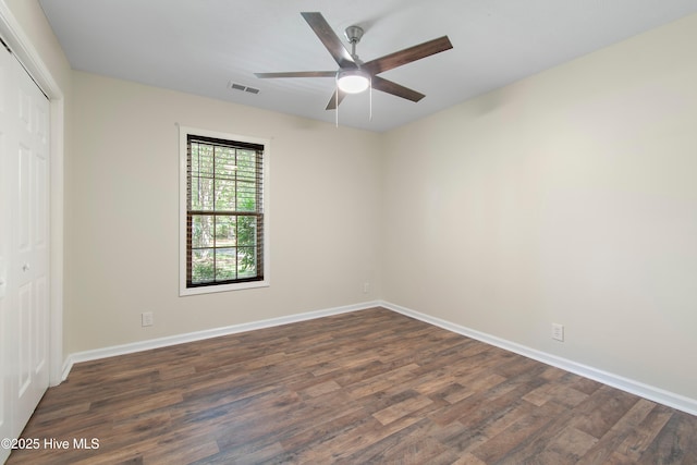 3 Gate 11, Carolina Shores, NC 28467 - unfurnished bedroom with dark wood-type flooring, a closet, and ceiling fan