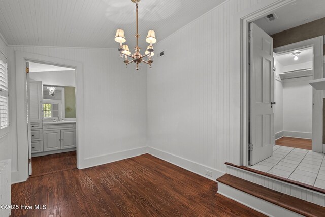 3 Augusta Way, Pinehurst, NC 28374 - unfurnished dining area featuring a chandelier and dark wood-style flooring