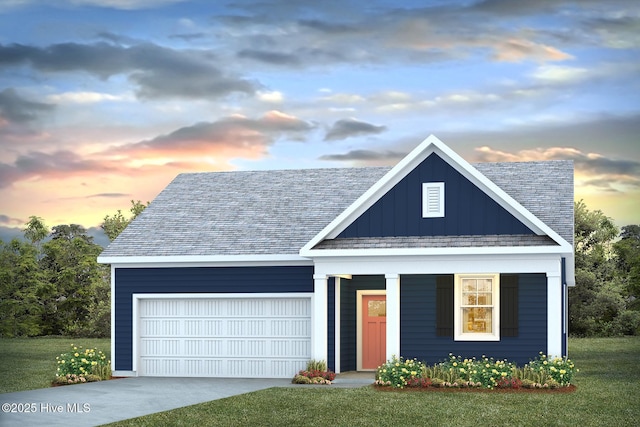 147 Legare St Lot 251, Wilmington, NC 28411 - view of front of property with board and batten siding, an attached garage, driveway, covered porch, and a yard
