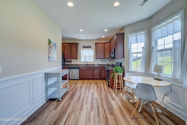 463 Avendale Dr, Rocky Point, NC 28457 - kitchen featuring electric stove, dishwasher, light wood-style floors, recessed lighting, and a wainscoted wall