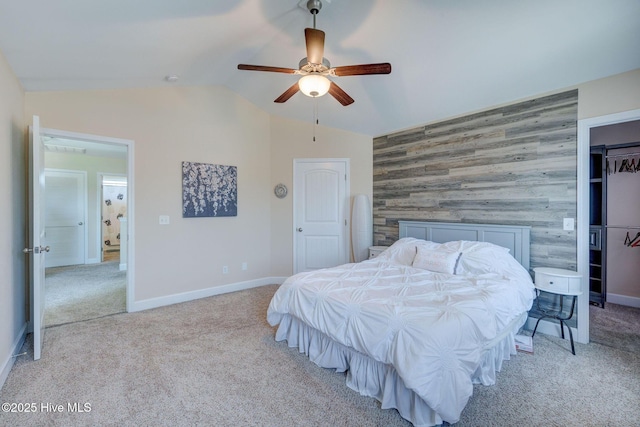463 Avendale Dr, Rocky Point, NC 28457 - bedroom featuring an accent wall, light carpet, lofted ceiling, wood walls, and ceiling fan