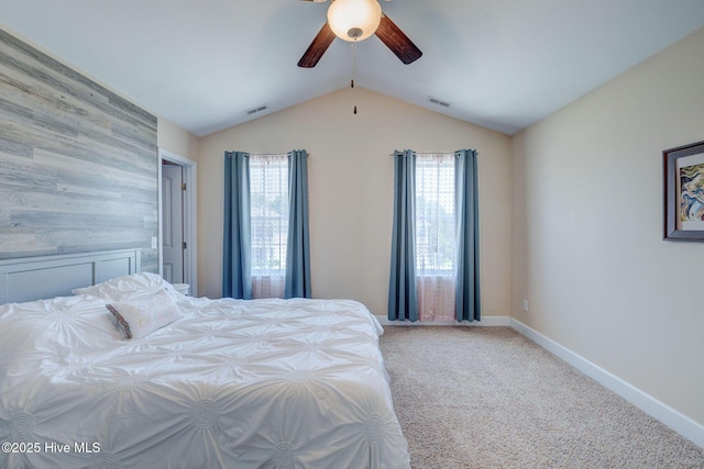 463 Avendale Dr, Rocky Point, NC 28457 - bedroom featuring multiple windows, vaulted ceiling, carpet flooring, and ceiling fan