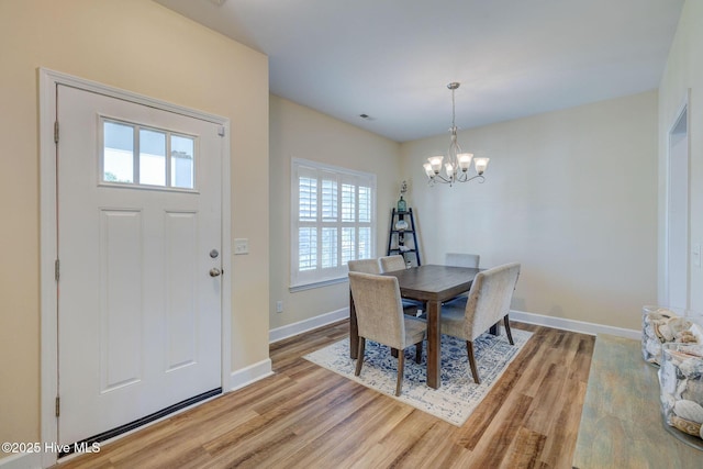 463 Avendale Dr, Rocky Point, NC 28457 - dining room featuring light wood-type flooring and a chandelier
