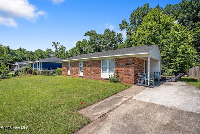 1106 E Stewart Cir, Wilmington, NC 28405 - single story home featuring concrete driveway, brick siding, a carport, and roof with shingles