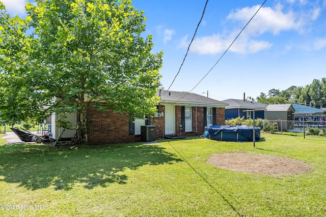 1106 E Stewart Cir, Wilmington, NC 28405 - rear view of house featuring brick siding and a covered pool
