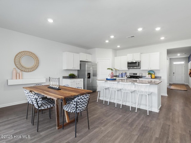 112 Edgewater Way Unit 57, Surf City, NC 28445 - dining room featuring dark wood-style flooring and recessed lighting