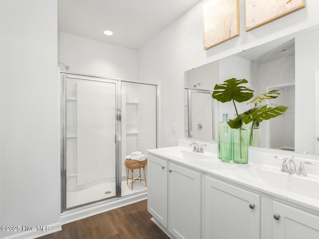 112 Edgewater Way Unit 57, Surf City, NC 28445 - bathroom with a stall shower, double vanity, and wood finished floors