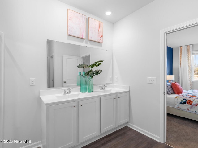 112 Edgewater Way Unit 57, Surf City, NC 28445 - ensuite bathroom featuring double vanity and wood finished floors
