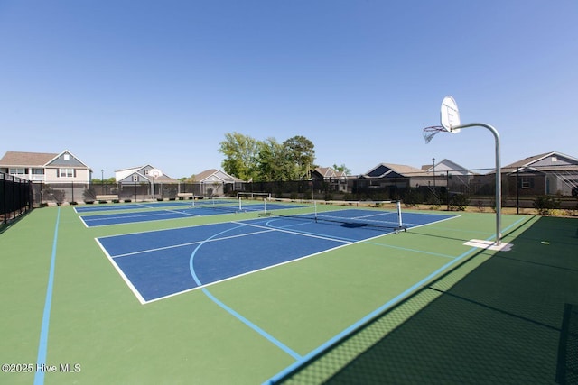 112 Edgewater Way Unit 57, Surf City, NC 28445 - view of tennis court with community basketball court and a residential view