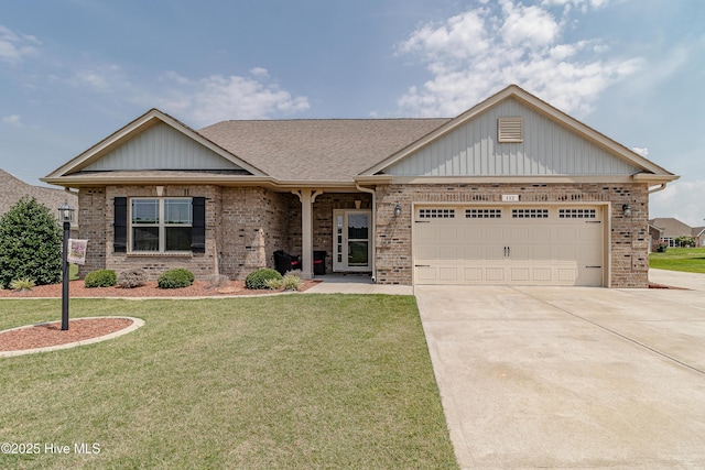 112 Mergini Dr, Pikeville, NC 27863 - view of front of house featuring brick siding, driveway, a front yard, an attached garage, and a shingled roof