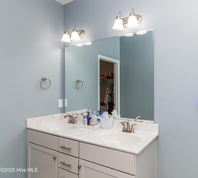 112 Mergini Dr, Pikeville, NC 27863 - bathroom featuring double vanity and a walk in closet