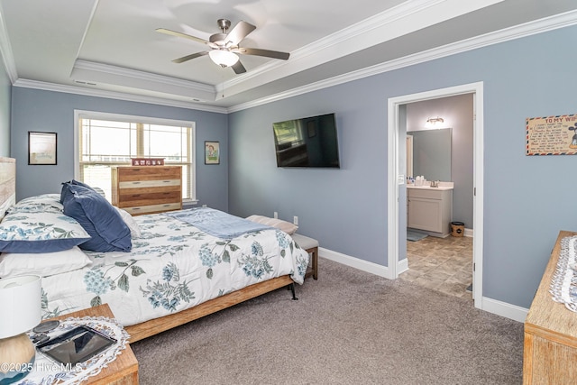 112 Mergini Dr, Pikeville, NC 27863 - bedroom featuring a tray ceiling, crown molding, carpet floors, ceiling fan, and ensuite bath
