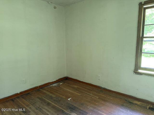 120 Bazemore Ln, Sunbury, NC 27979 - spare room with wood-type flooring and baseboards