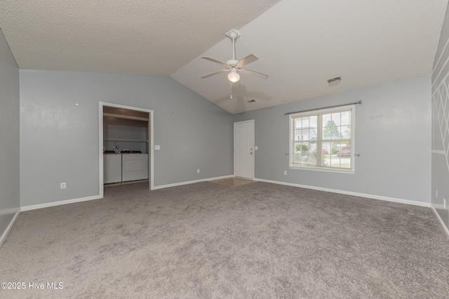 6723 Newbury Way, Wilmington, NC 28411 - unfurnished bedroom featuring washing machine and clothes dryer, vaulted ceiling, carpet floors, and ceiling fan