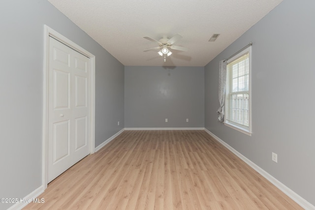 6723 Newbury Way, Wilmington, NC 28411 - spare room featuring ceiling fan, light wood finished floors, and a textured ceiling
