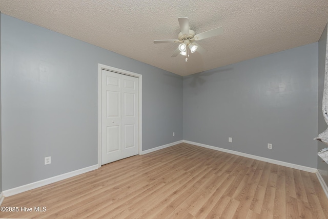 6723 Newbury Way, Wilmington, NC 28411 - unfurnished room with light wood-style flooring, a ceiling fan, and a textured ceiling
