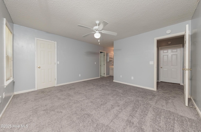 6723 Newbury Way, Wilmington, NC 28411 - unfurnished bedroom featuring carpet flooring, a textured ceiling, and ceiling fan
