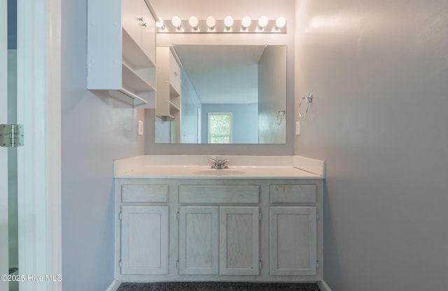 6723 Newbury Way, Wilmington, NC 28411 - bathroom with vanity and baseboards