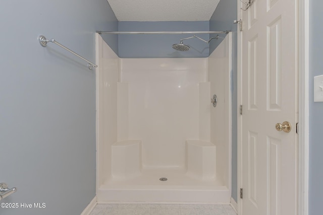 6723 Newbury Way, Wilmington, NC 28411 - bathroom with a shower and a textured ceiling