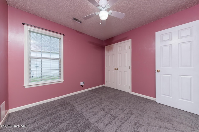6723 Newbury Way, Wilmington, NC 28411 - unfurnished bedroom featuring carpet, a textured ceiling, a closet, and ceiling fan