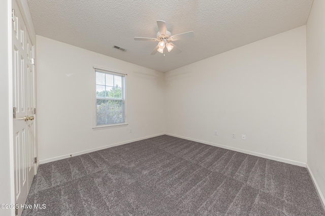 6723 Newbury Way, Wilmington, NC 28411 - spare room with a ceiling fan, dark carpet, and a textured ceiling