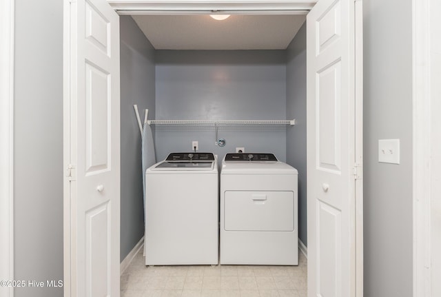 6723 Newbury Way, Wilmington, NC 28411 - laundry area with washer and dryer and light tile patterned floors