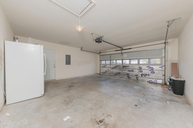 6723 Newbury Way, Wilmington, NC 28411 - garage with freestanding refrigerator, electric panel, and a garage door opener