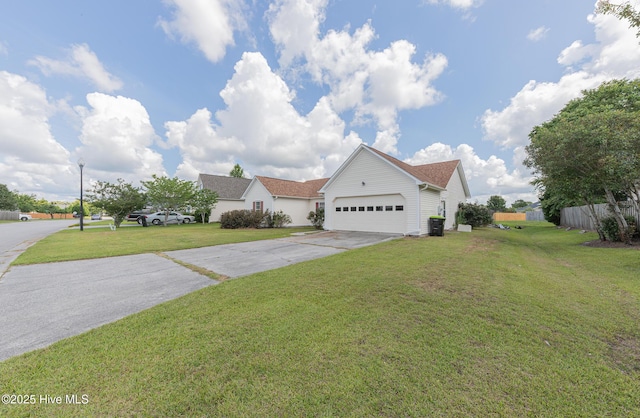6723 Newbury Way, Wilmington, NC 28411 - view of front facade featuring concrete driveway, an attached garage, and a front yard