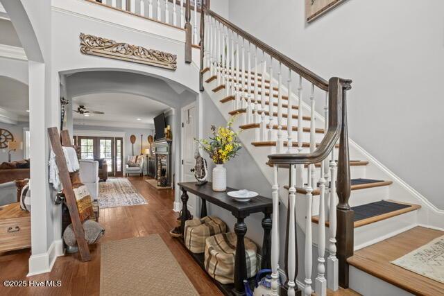 400 Lanyard Dr, Newport, NC 28570 - stairs with arched walkways, ceiling fan, and wood finished floors