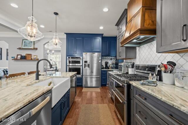 400 Lanyard Dr, Newport, NC 28570 - kitchen featuring stainless steel appliances, premium range hood, dark wood finished floors, light stone countertops, and decorative light fixtures