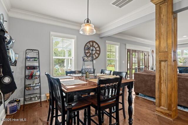 400 Lanyard Dr, Newport, NC 28570 - dining room featuring wood finished floors, plenty of natural light, ornate columns, and crown molding