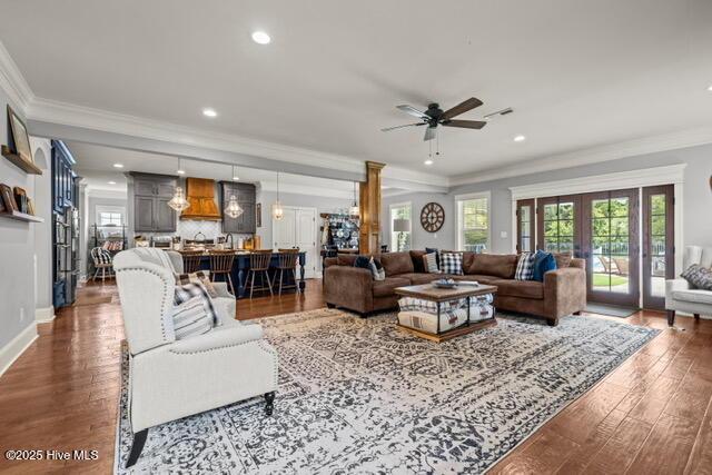 400 Lanyard Dr, Newport, NC 28570 - living area featuring ceiling fan, dark wood-type flooring, plenty of natural light, crown molding, and recessed lighting