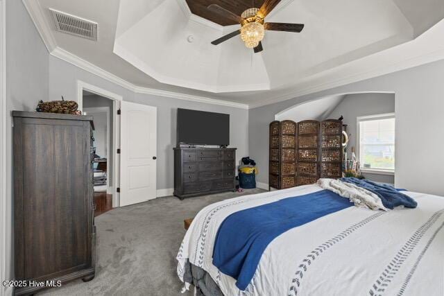 400 Lanyard Dr, Newport, NC 28570 - carpeted bedroom with a tray ceiling, crown molding, and a ceiling fan