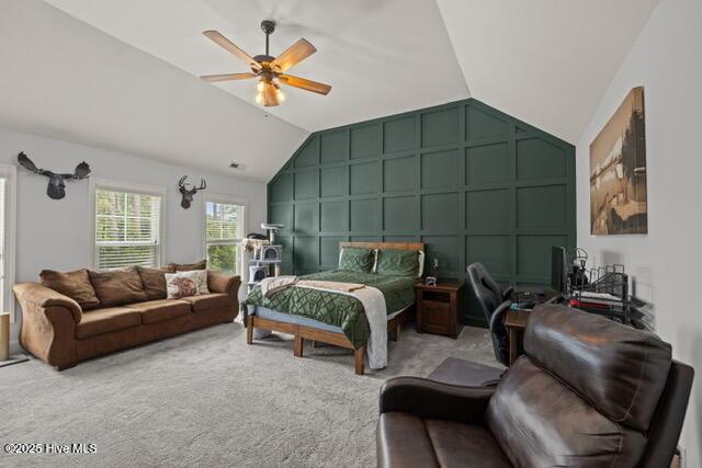 400 Lanyard Dr, Newport, NC 28570 - bedroom with a decorative wall, vaulted ceiling, carpet floors, and a ceiling fan
